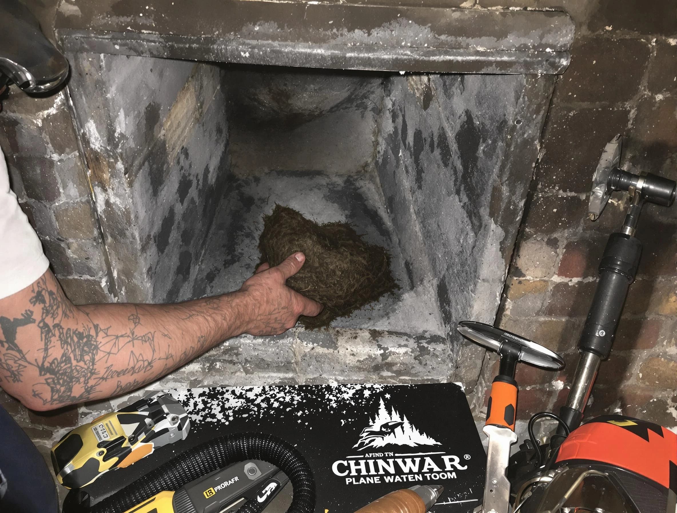 White City Chimney Sweep safely removing debris and screening chimney in White City, UT